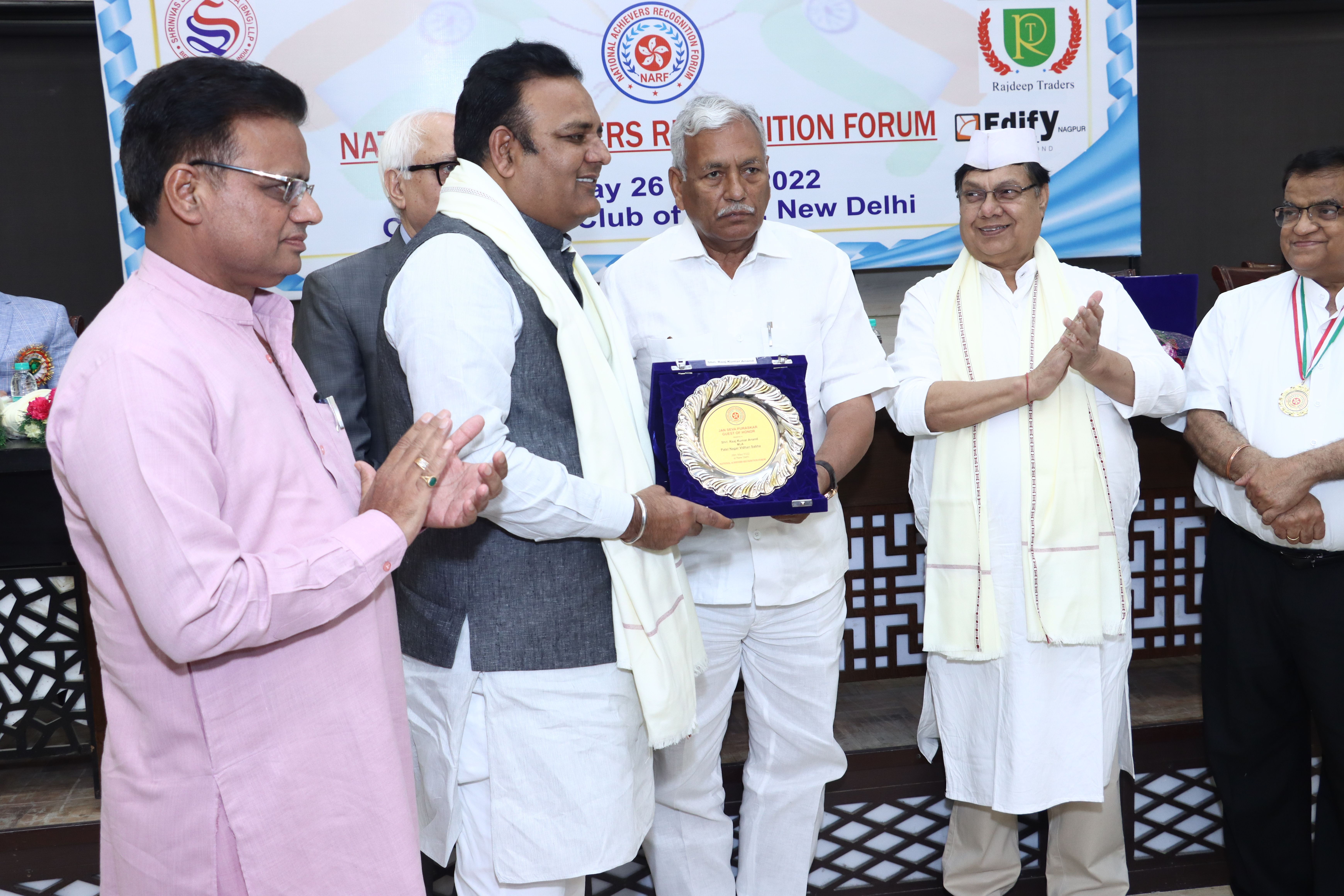 Sh. Raaj Kumar Anand Honorable Cabinet Minister Govt. of Delhi Receiving the Award by Sh. Ram Niwas Goel Honorable Speaker Delhi Vidhan Sabha. 